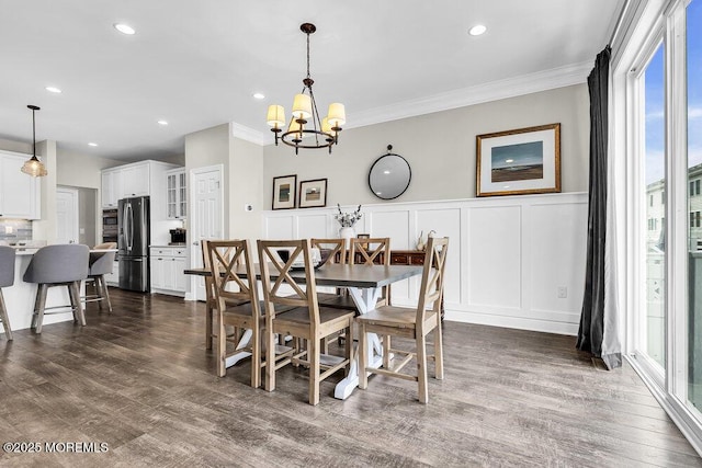 30 Malcolm Way, Lincroft, NJ 07738 - dining room featuring a decorative wall, a chandelier, ornamental molding, dark wood-style floors, and wainscoting