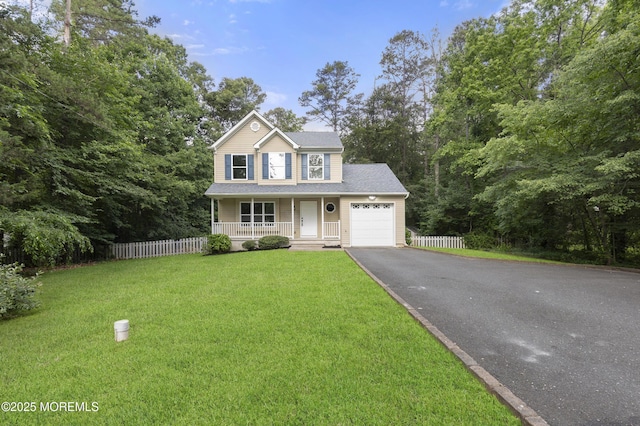 10 Postol Rd, Cream Ridge, NJ 08514 - view of front facade with covered porch, driveway, and a garage