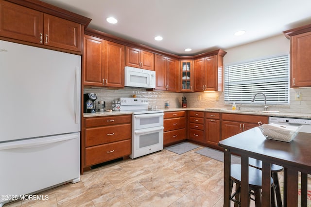 799B Westminster Ct Unit B, Manchester, NJ 08759 - kitchen with white appliances, decorative backsplash, brown cabinetry, glass insert cabinets, and recessed lighting