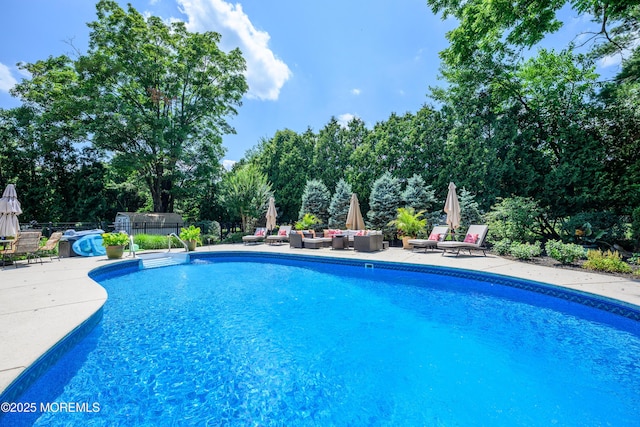 9 Partridge Ave, Freehold, NJ 07728 - outdoor pool with a patio, outdoor lounge area, and view of scattered trees