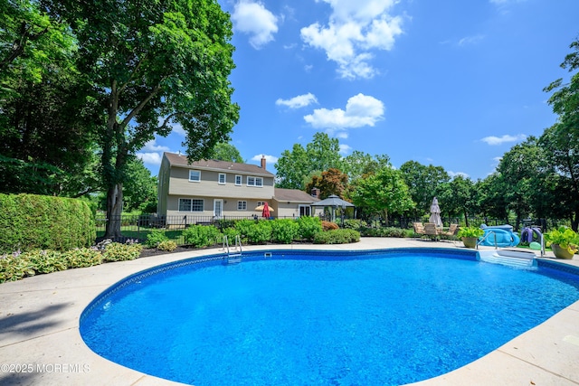 9 Partridge Ave, Freehold, NJ 07728 - view of swimming pool featuring view of wooded area and a patio