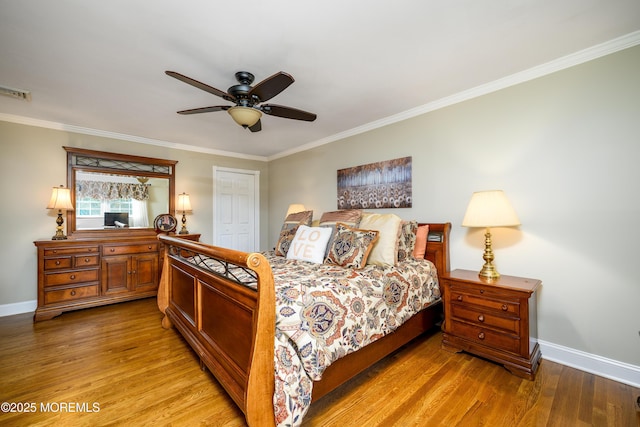 9 Partridge Ave, Freehold, NJ 07728 - bedroom with crown molding, wood finished floors, ceiling fan, and a closet