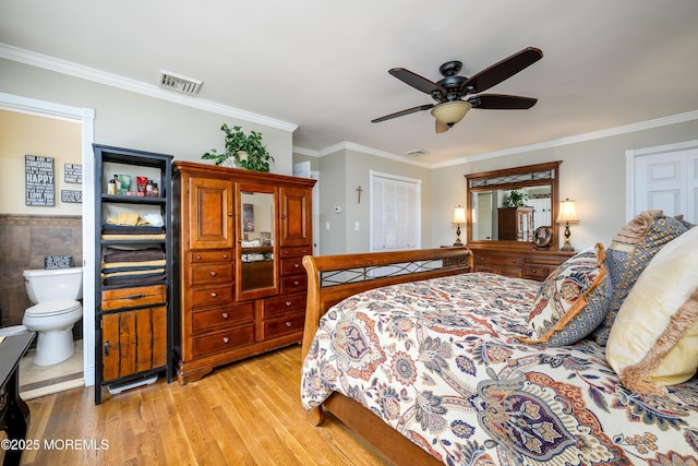 9 Partridge Ave, Freehold, NJ 07728 - bedroom with light wood finished floors, crown molding, ensuite bath, a ceiling fan, and tile walls