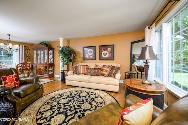 9 Partridge Ave, Freehold, NJ 07728 - living area featuring plenty of natural light, wood finished floors, and a chandelier