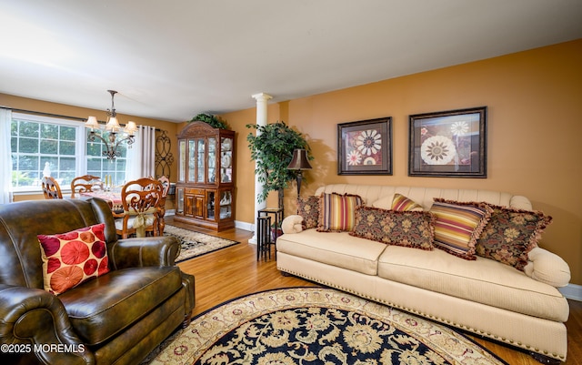 9 Partridge Ave, Freehold, NJ 07728 - living room with light wood-style floors and a chandelier