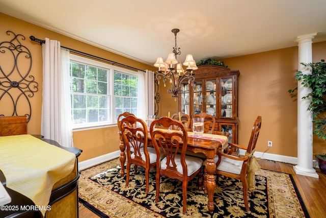9 Partridge Ave, Freehold, NJ 07728 - dining space with a chandelier, light wood-style flooring, and decorative columns