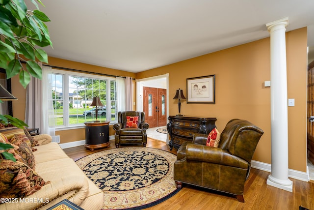9 Partridge Ave, Freehold, NJ 07728 - living room with decorative columns and wood finished floors
