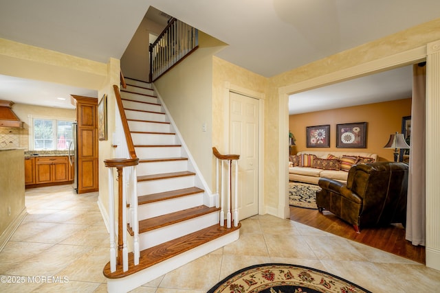 9 Partridge Ave, Freehold, NJ 07728 - stairs featuring tile patterned floors and baseboards