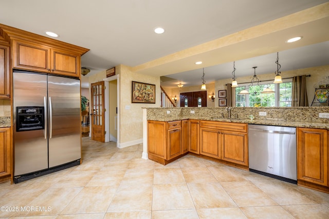 9 Partridge Ave, Freehold, NJ 07728 - kitchen featuring stainless steel appliances, brown cabinets, light stone countertops, and recessed lighting