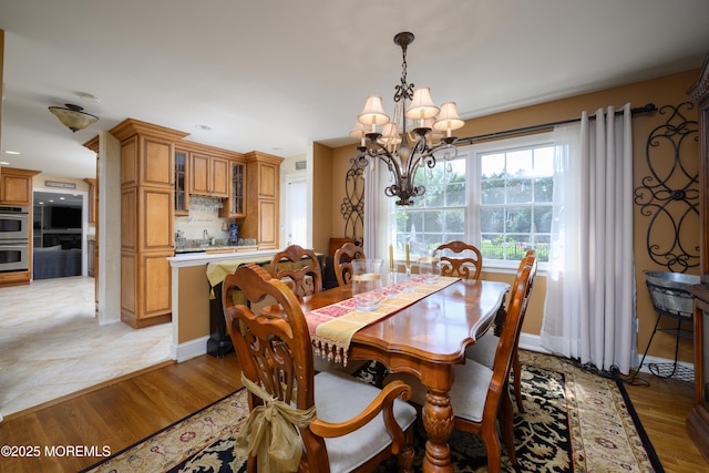 9 Partridge Ave, Freehold, NJ 07728 - dining area featuring a chandelier and light wood finished floors