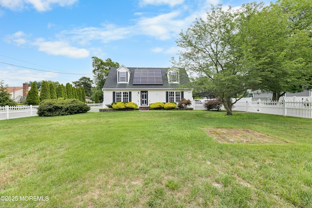 12 Liberty St, Old Bridge, NJ 08857 - rear view of property with roof mounted solar panels, a fenced backyard, and roof with shingles