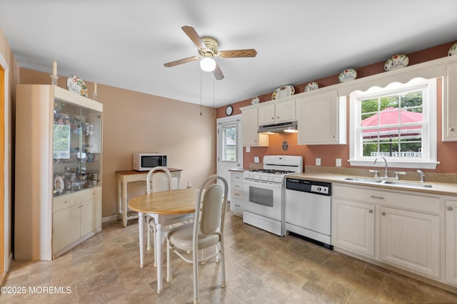 12 Liberty St, Old Bridge, NJ 08857 - kitchen featuring white appliances, under cabinet range hood, stone finish flooring, a ceiling fan, and white cabinets