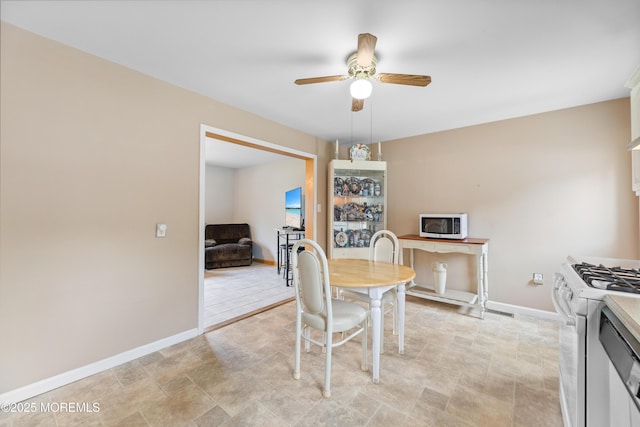 12 Liberty St, Old Bridge, NJ 08857 - dining area with ceiling fan and stone finish flooring