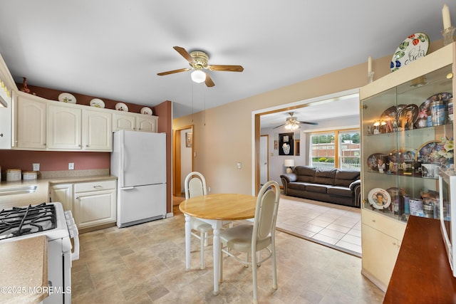 12 Liberty St, Old Bridge, NJ 08857 - kitchen featuring white appliances, ceiling fan, light countertops, and white cabinetry