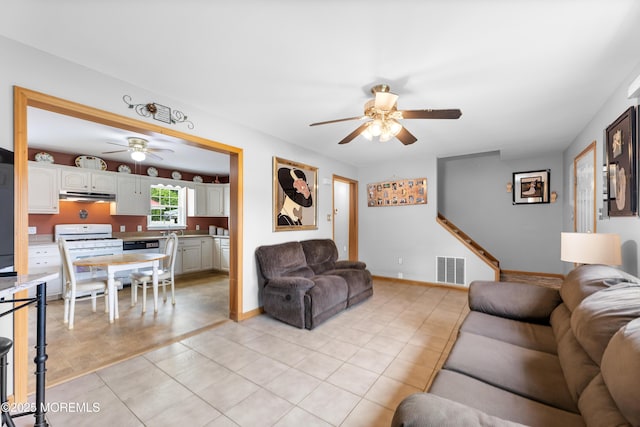 12 Liberty St, Old Bridge, NJ 08857 - living room with ceiling fan and light tile patterned floors