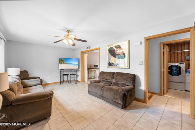 12 Liberty St, Old Bridge, NJ 08857 - living area featuring washer / clothes dryer, a ceiling fan, and light tile patterned floors