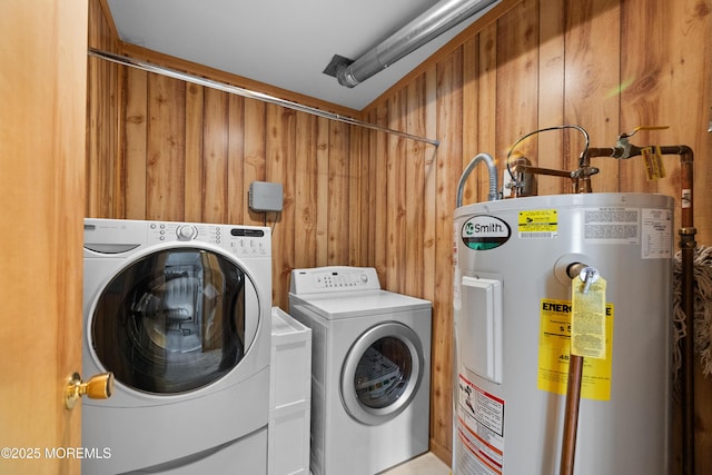 12 Liberty St, Old Bridge, NJ 08857 - laundry room featuring water heater, washer and dryer, and wood walls
