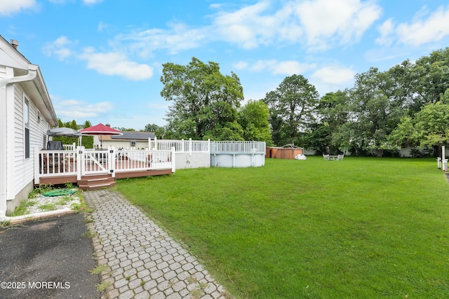 12 Liberty St, Old Bridge, NJ 08857 - view of grassy yard with a wooden deck and an outdoor pool