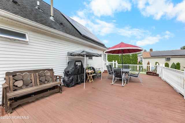 12 Liberty St, Old Bridge, NJ 08857 - wooden deck with outdoor dining space and a grill
