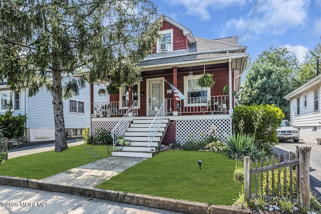 194 Washington St, Keyport, NJ 07735 - view of front of home featuring a porch, a shingled roof, a front lawn, and stairway