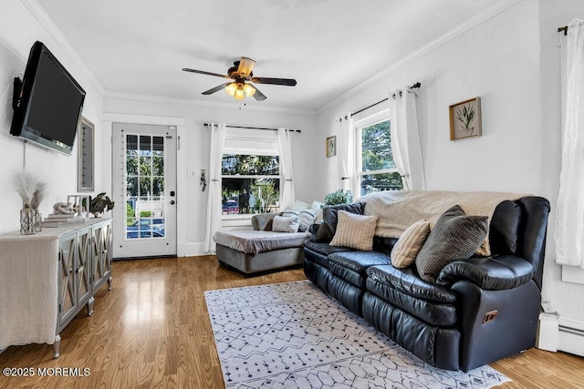 194 Washington St, Keyport, NJ 07735 - living room featuring wood finished floors, a ceiling fan, ornamental molding, and a baseboard radiator