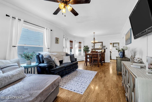 194 Washington St, Keyport, NJ 07735 - living room with a chandelier, wood finished floors, a ceiling fan, and crown molding