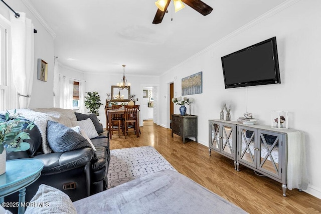 194 Washington St, Keyport, NJ 07735 - living area featuring ceiling fan, a chandelier, wood finished floors, and crown molding