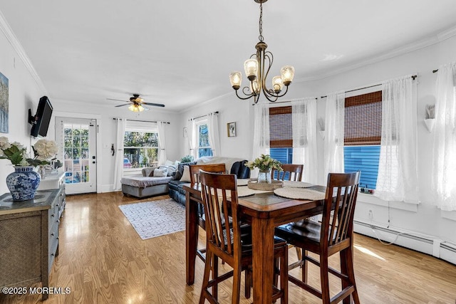 194 Washington St, Keyport, NJ 07735 - dining room featuring crown molding, light wood-style flooring, a ceiling fan, and a chandelier