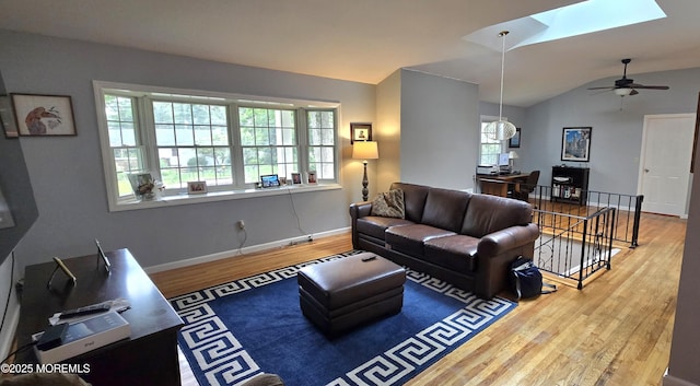 20 Woodridge Ave, Toms River, NJ 08755 - living area with wood finished floors, plenty of natural light, a skylight, vaulted ceiling, and a ceiling fan