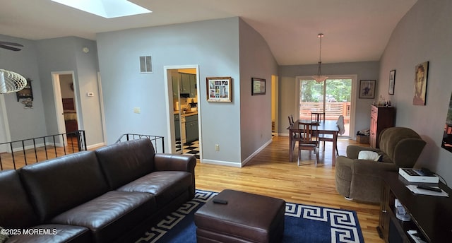 20 Woodridge Ave, Toms River, NJ 08755 - living room with a skylight, light wood finished floors, and lofted ceiling