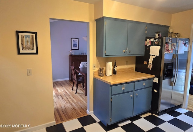 20 Woodridge Ave, Toms River, NJ 08755 - kitchen with stainless steel fridge with ice dispenser, light flooring, light countertops, and blue cabinets
