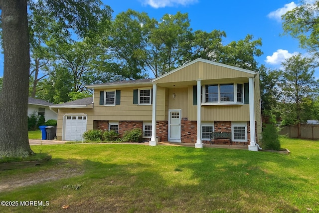 20 Woodridge Ave, Toms River, NJ 08755 - raised ranch with brick siding, an attached garage, and driveway
