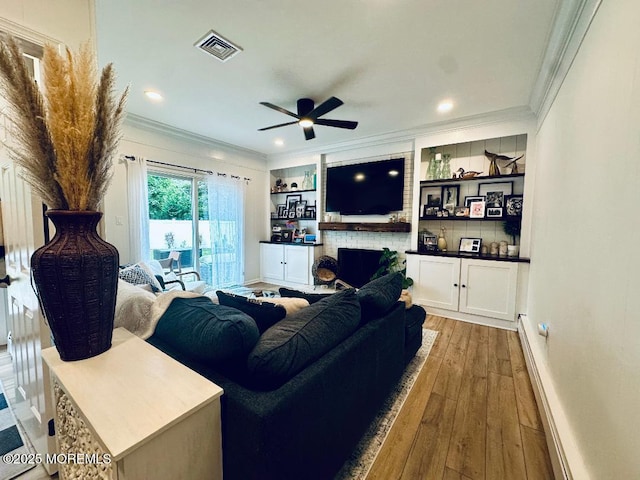 412 Steuben Ave, Forked River, NJ 08731 - living area featuring crown molding, a ceiling fan, a fireplace, wood finished floors, and recessed lighting