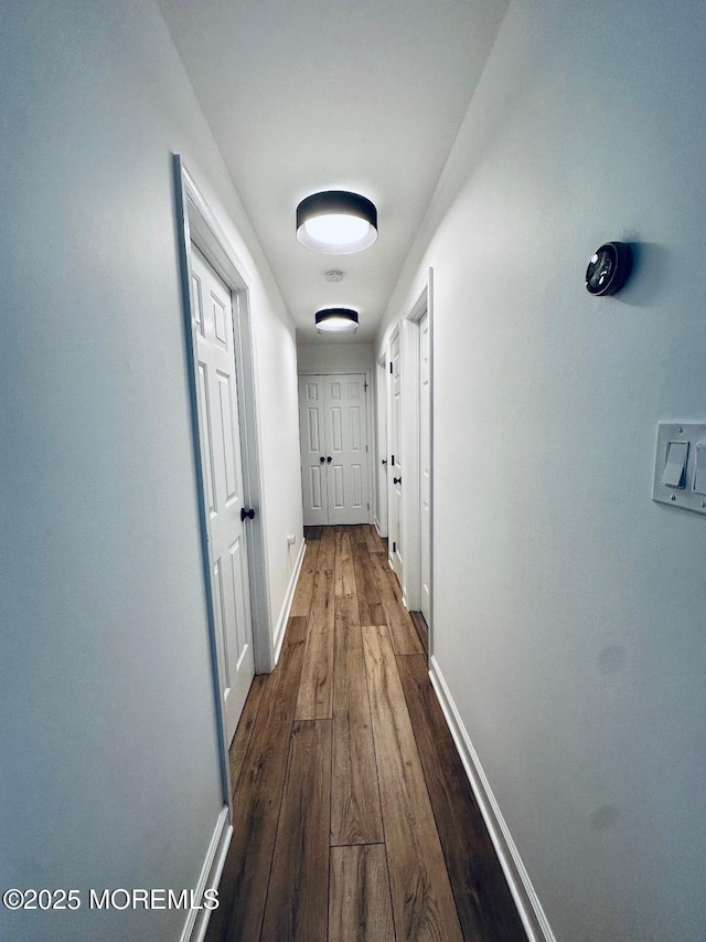 412 Steuben Ave, Forked River, NJ 08731 - corridor with baseboards and dark wood-style flooring