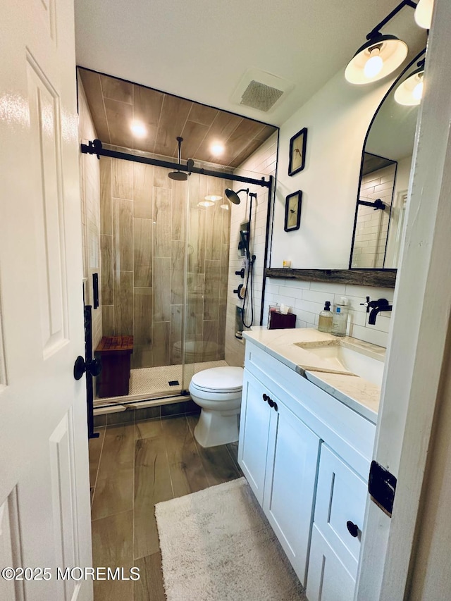 412 Steuben Ave, Forked River, NJ 08731 - bathroom featuring vanity, a stall shower, wood finished floors, and decorative backsplash