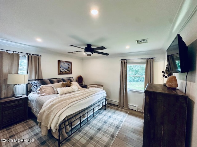 412 Steuben Ave, Forked River, NJ 08731 - bedroom featuring wood finished floors, a baseboard radiator, recessed lighting, and ceiling fan
