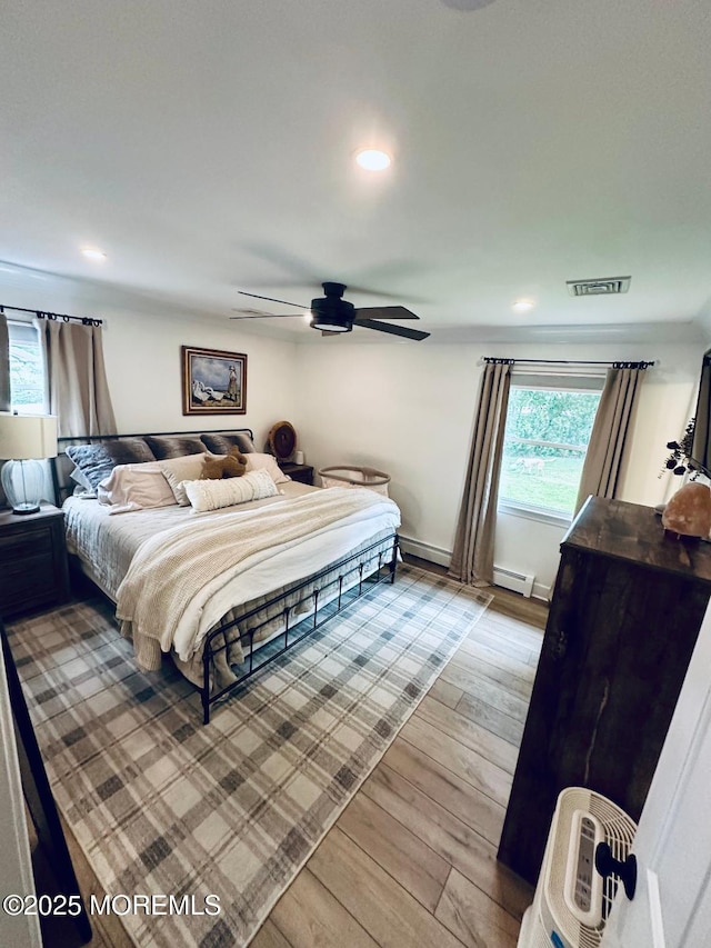 412 Steuben Ave, Forked River, NJ 08731 - bedroom featuring light wood-style floors, recessed lighting, a baseboard radiator, and a ceiling fan