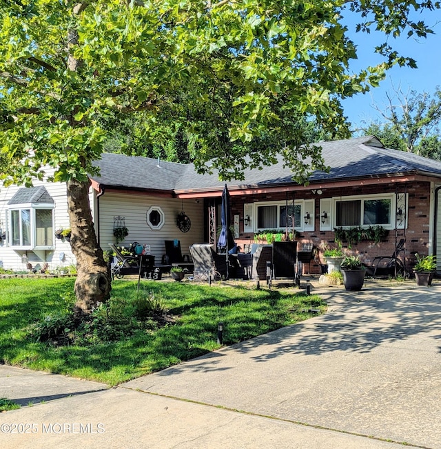 113 Sunshine Pkwy, Neptune Township, NJ 07753 - view of front of home featuring covered porch, a front yard, and a shingled roof
