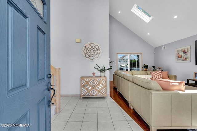 17 W Coral Dr, Brick, NJ 08723 - living area with high vaulted ceiling, a skylight, light tile patterned floors, and recessed lighting