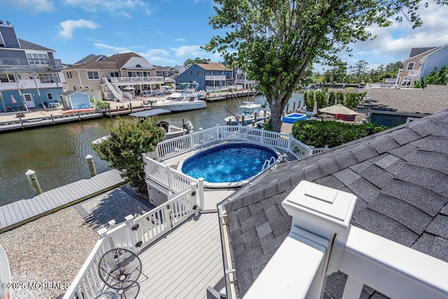 17 W Coral Dr, Brick, NJ 08723 - view of swimming pool featuring a water view, a jacuzzi, a dock, and a residential view