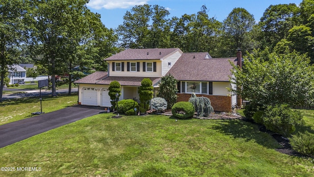 1 Spruce Way, Manalapan, NJ 07726 - traditional-style home with an attached garage, asphalt driveway, a front lawn, a shingled roof, and brick siding