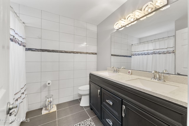 1 Spruce Way, Manalapan, NJ 07726 - bathroom with double vanity, tile walls, and tile patterned flooring