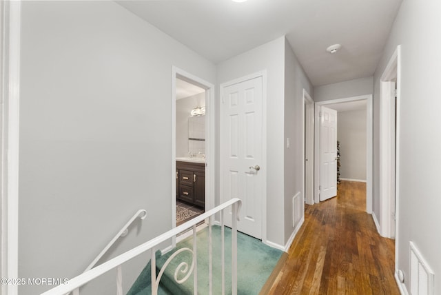 1 Spruce Way, Manalapan, NJ 07726 - hallway featuring wood finished floors and baseboards
