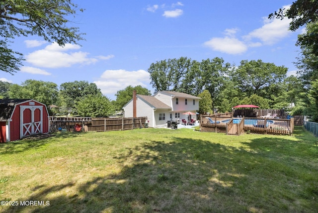 1 Spruce Way, Manalapan, NJ 07726 - fenced backyard featuring a shed and view of wooded area