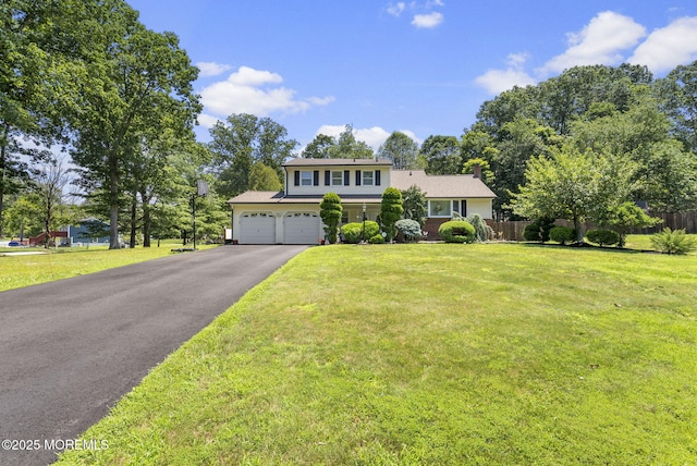1 Spruce Way, Manalapan, NJ 07726 - traditional-style house featuring asphalt driveway and an attached garage