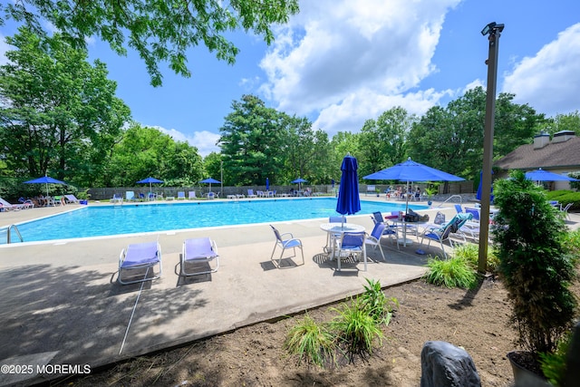 45 Liverpool Ct Unit 10, Freehold, NJ 07728 - community pool with a patio and view of scattered trees