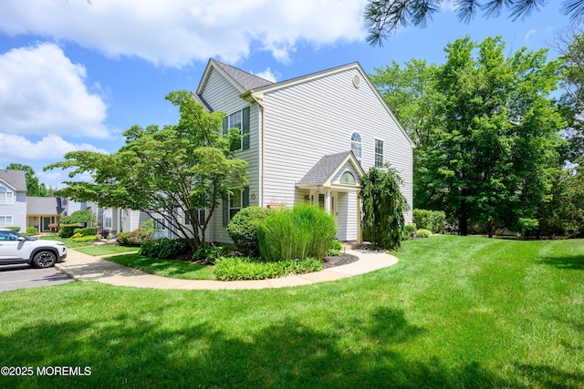 45 Liverpool Ct Unit 10, Freehold, NJ 07728 - view of property exterior featuring a lawn