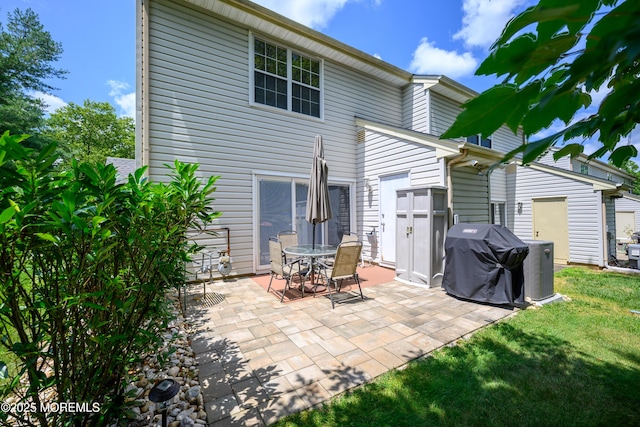 45 Liverpool Ct Unit 10, Freehold, NJ 07728 - rear view of property with a patio and a yard