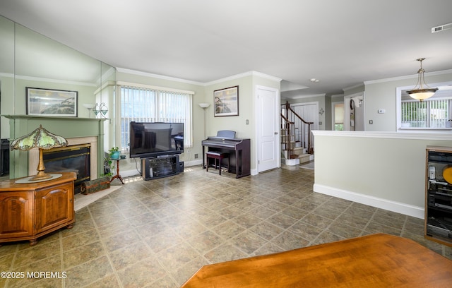 45 Liverpool Ct Unit 10, Freehold, NJ 07728 - living area featuring plenty of natural light, stairs, crown molding, and a high end fireplace