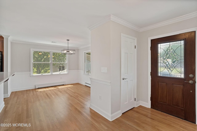 6 Frances Ct, Red Bank, NJ 07701 - entryway with baseboard heating, light wood-style flooring, a chandelier, crown molding, and a baseboard radiator